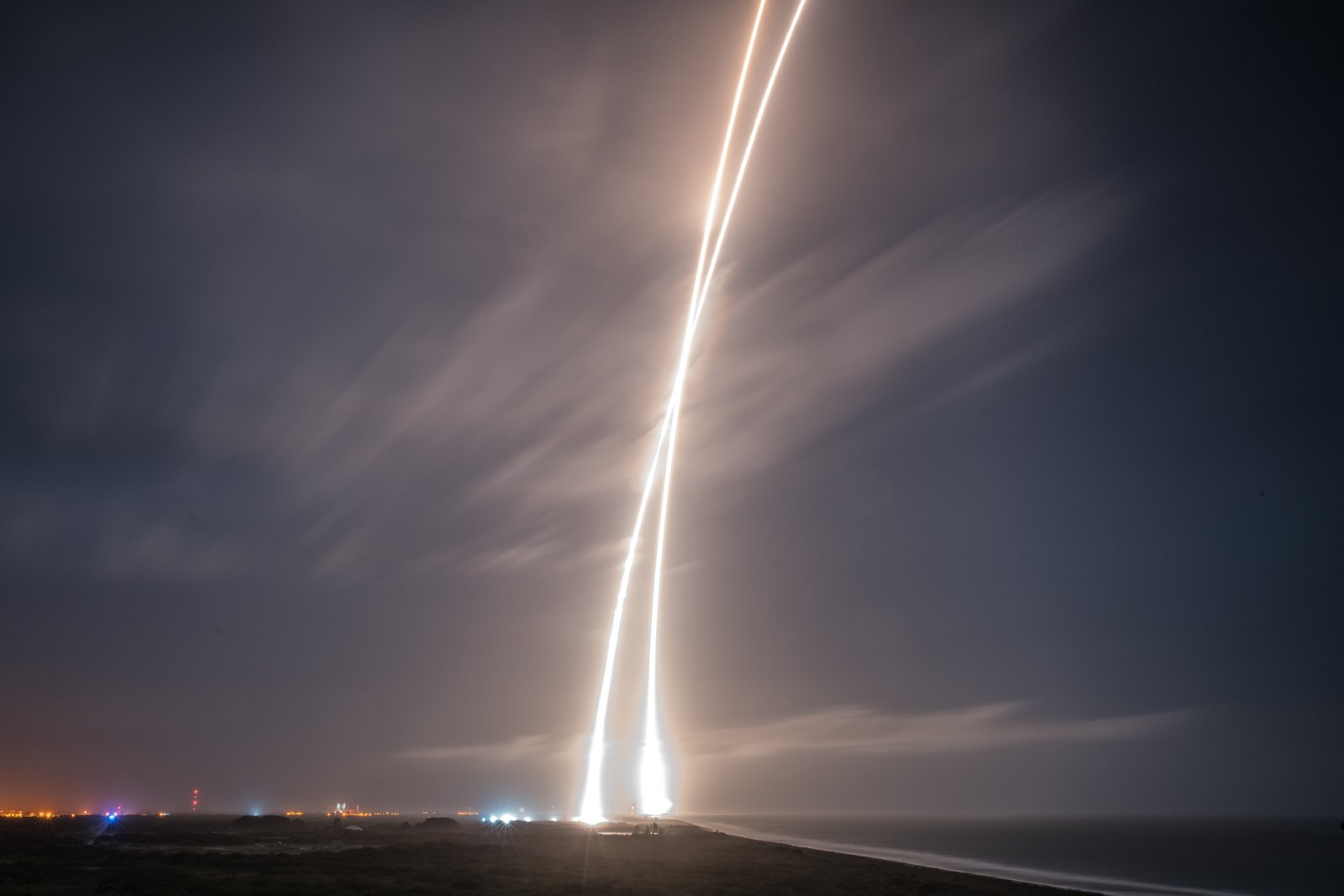 Nine-minute exposure picture of the launch, re-entry and landing burns of SpaceX's Falcon 9 rocket at Cape Canaveral Air Force Station.